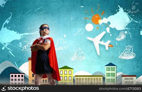 Little superhero. Cute girl of school age wearing super hero costume
