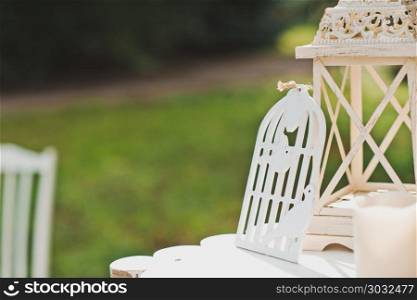 Little table with flowers and beautiful things in a garden.. Decorative interior outdoors 2157.. Decorative interior outdoors 2157.