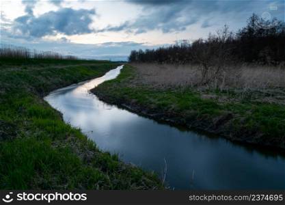 Little Uherka River and evening clouds, Stankow, Lubelskie, Poland