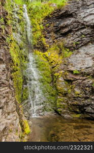 Little waterfall in green summer mountains, Norway.. Little waterfall in mountains, Norway.