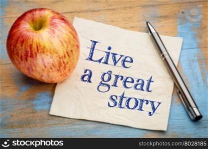 Live a great story - handwriting on a napkin with a fresh apple