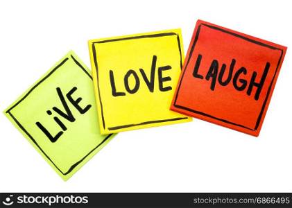 live, love, laugh - motivational words on sticky note reminders isolated on white