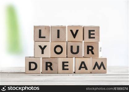 Live your dream on wooden cubes on a table