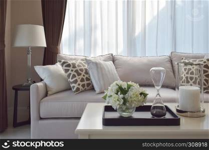 living room design with sturdy tweed sofa with brown patterned pillows