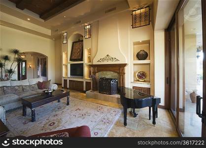 Living room with baby Grand Piano in Palm Springs home