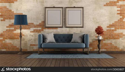 Living room with blue classic sofa,floor lamp and picture frane agaist old brick wall - 3d rendering. Living room with blue classic sofa and old brick wall