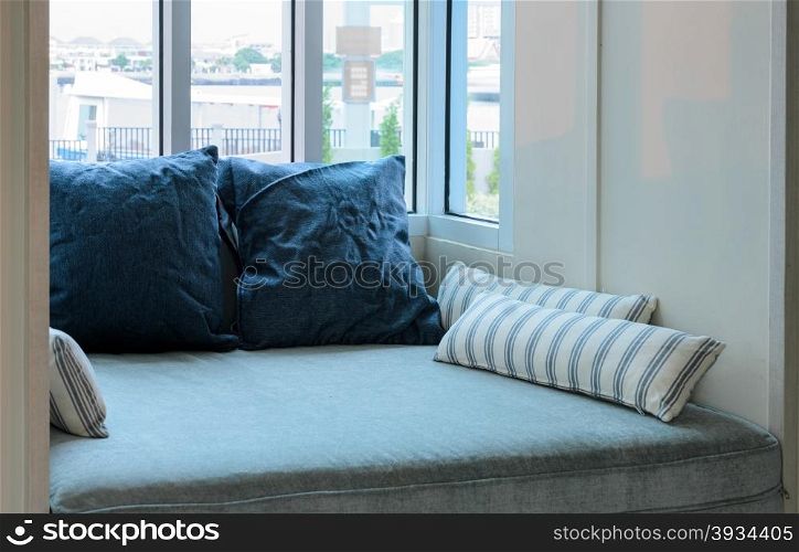 Living room with cushions and glass window
