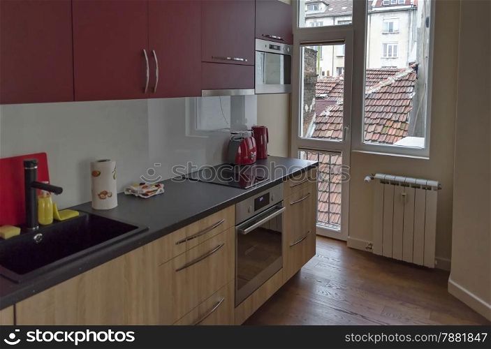 Living room with kitchen site and dining-table in renovated apartment in Sofia, Bulgaria