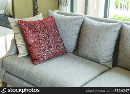 living room with row of pillows on sofa at home