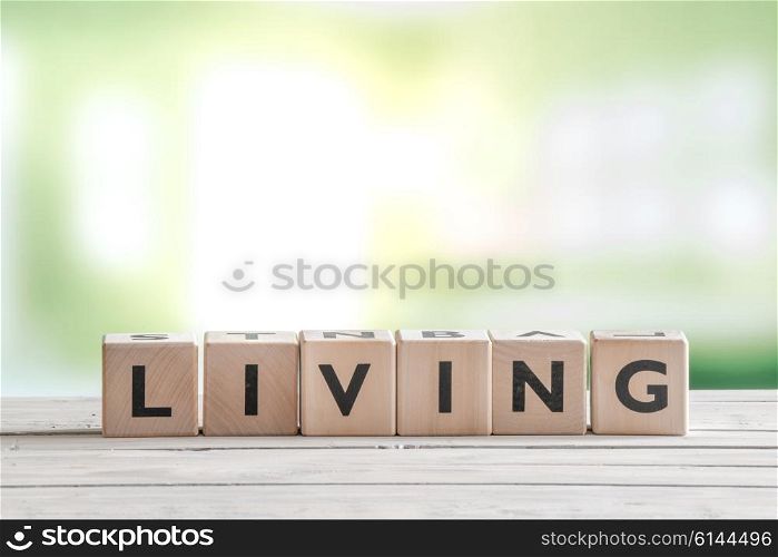 Living word on wooden cubes on a wooden table