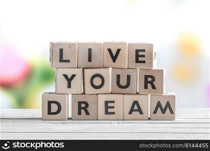 Living your dream message on wooden cubes on a table