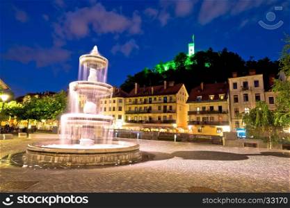 Ljubljana fountain and castle evening view, capital of Slovenia
