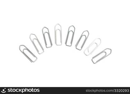 Loads of paper clips isolated on white
