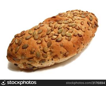 Loaf of artisan pumpkin seed and cranberry bread on white background