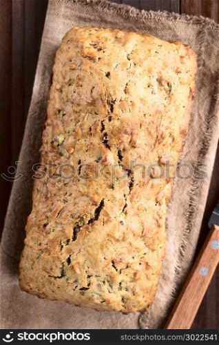 Loaf of fresh homemade zucchini and walnut quick bread (Selective Focus, Focus on the top of the bread) . Zucchini and Walnut Bread