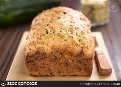 Loaf of fresh homemade zucchini and walnut quick bread (Selective Focus, Focus on the front upper edge of the bread) . Zucchini and Walnut Bread