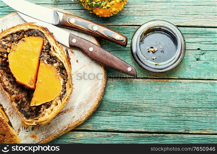 Loaf with baked pumpkin and mushrooms.Wellington pumpkin, autumn traditional food.. Wellington pumpkin,autumn food