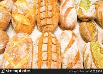 Loafs of fresh bread in bakery shop
