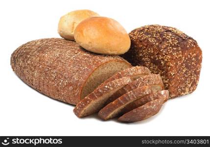 loafs of whole wheat and rye bread on light background