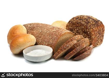 loafs of whole wheat and rye bread on light background
