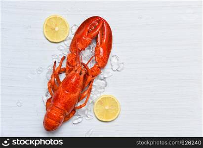 Lobster food on ice seafood shrimp with lemon on white wooden table dinner background on top view