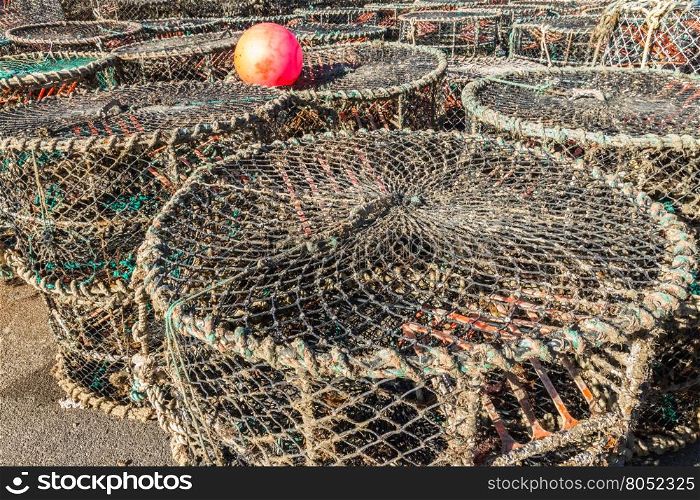 Lobster nets with other sea fishing gear such as ropes and plastic buoys.