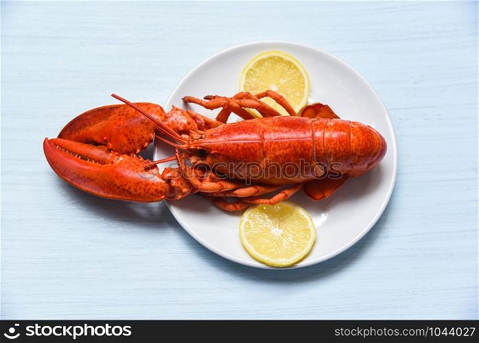 Lobster on plate seafood shellfish shrimp with lemon on white table background