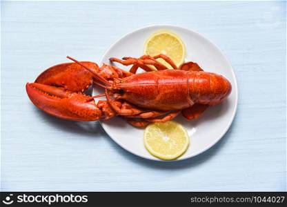 Lobster on plate seafood shellfish shrimp with lemon on white table background