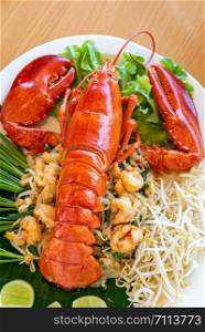 Lobster Pad thai, stir fried Thai rice noodle pasta with whole lobster and lobster meat.