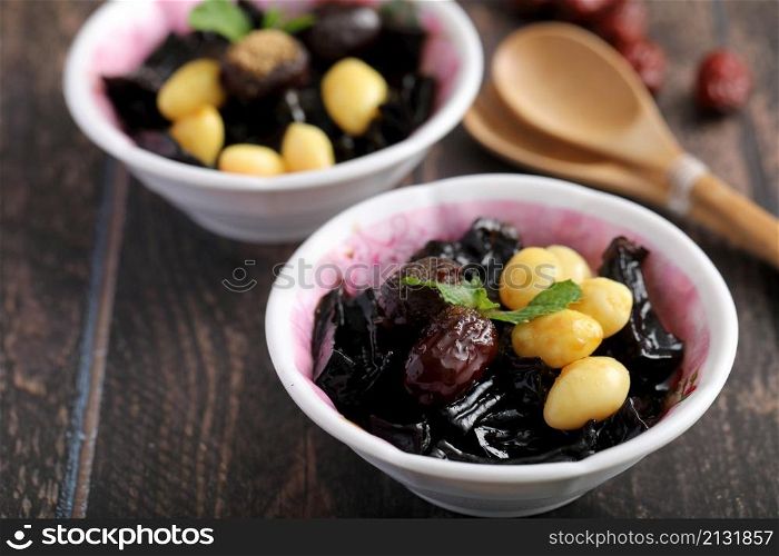Local Thai dessert glass jelly isolated in wood background