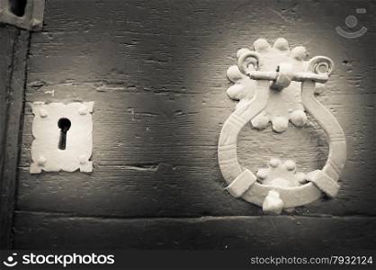 Lock and knocker of an old wooden door