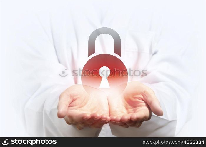 Lock icon in palms. Close up of businesswoman hand holding digital icon in palm