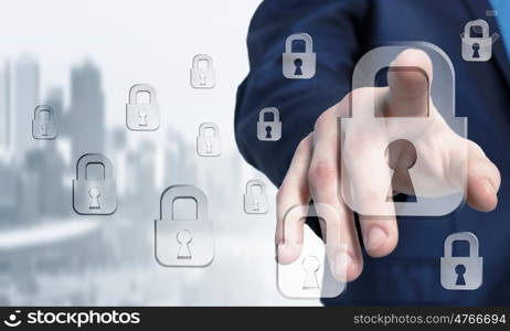 Lock icon on screen. Hand of businessman touching lock icon on digital screen