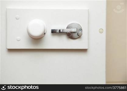 lock latch on bathroom white door