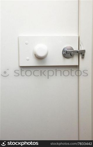 lock latch on bathroom white door