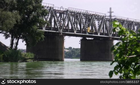 Locomotive movement on railway bridge.