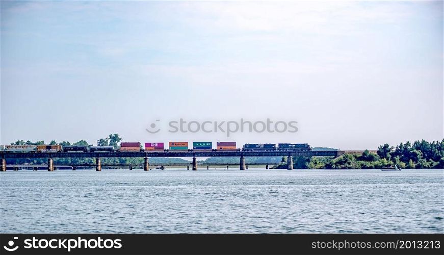 locomotive train bridge with train crossing lake