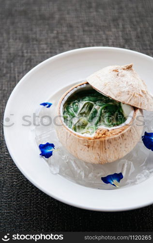 Lod Chong or Cendol, Thailand and southeast Asia country traditional refreshing cold sweet summer dessert with coconut milk served in coconut shell