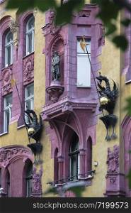 LODZ, POLAND - JULY 28, 2016: Fragment of the facade of the building with dragons - Piotrkovska street house 86 in Lodz. Poland