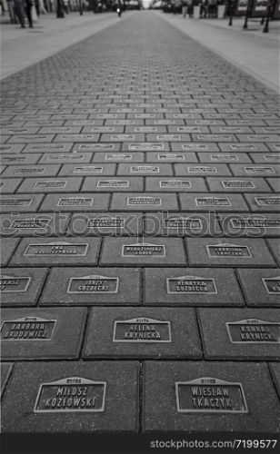 LODZ, POLAND - JULY 28, 2016: Monument to the inhabitants of Lodz The Rubezh of the Millennium is almost fourteen thousand concrete slabs with bronze plates on which are written the names of the inhabitants of Lodz, who somehow influenced the history of the city - the idea of the architect Zbigniew Binchek