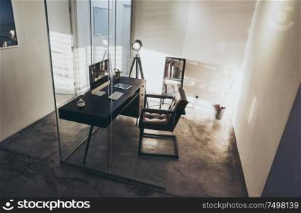 Loft and cozy interior design office with glass wall partition .