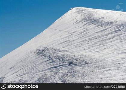 Lofty snow covered mount top on blue sky background (Ukraine, Carpathian Mt&rsquo;s, Svydovets Ridge, Blyznycja Mount)