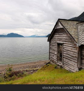 Log cabin at the riverside, Hardangervidda, Hardanger, Norway