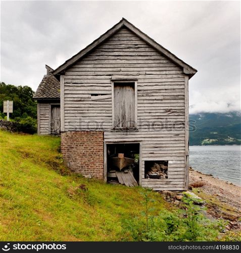 Log cabin at the riverside, Hardangervidda, Hardanger, Norway