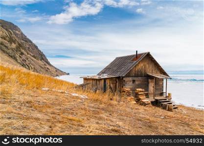 Log hut on the shore of Lake Baikal, Russia
