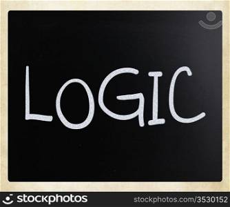 ""Logic" handwritten with white chalk on a blackboard."