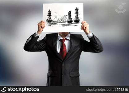Logic thinking. Businessman hiding face behind paper sheet. Strategy concept