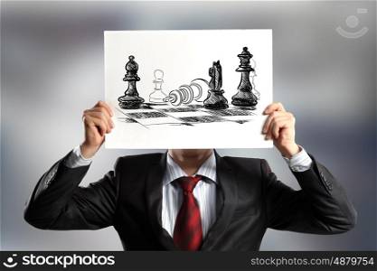 Logic thinking. Businessman hiding face behind paper sheet. Strategy concept