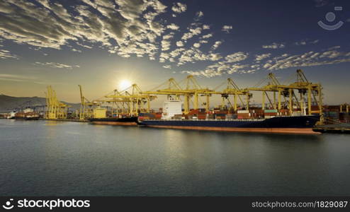 Logistic container ship from sea port warehouse with working crane bridge for delivery containers shipment. for transport or import export to global logistics concept.over the sunlight with blue sky background