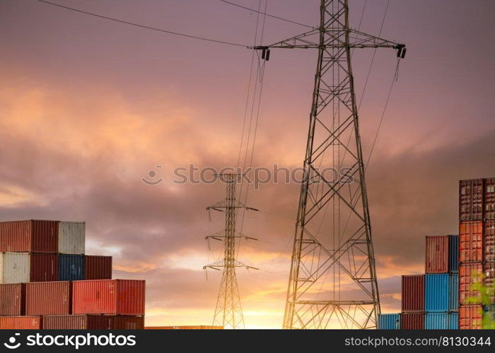 Logistic container stack with electric pylon. Cargo and shipping business. Container for truck transport. Container for import and export logistics. Logistic industry. Supply chain. Container freight.